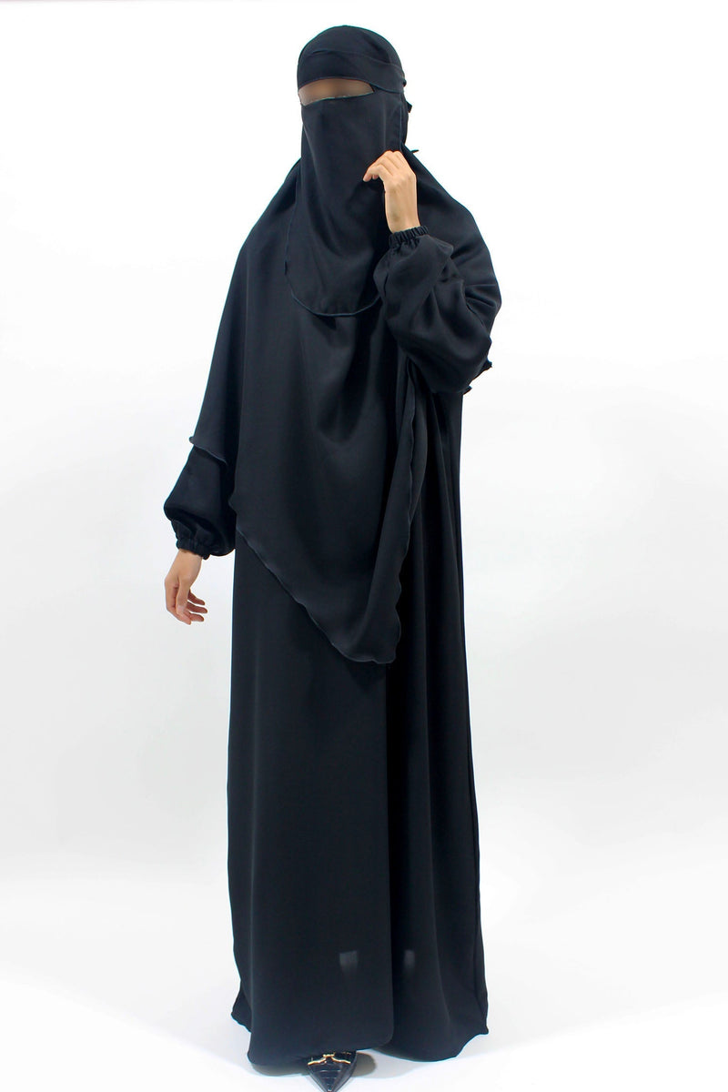 Black abaya, khimar and niqab set showing coordinated modest coverage