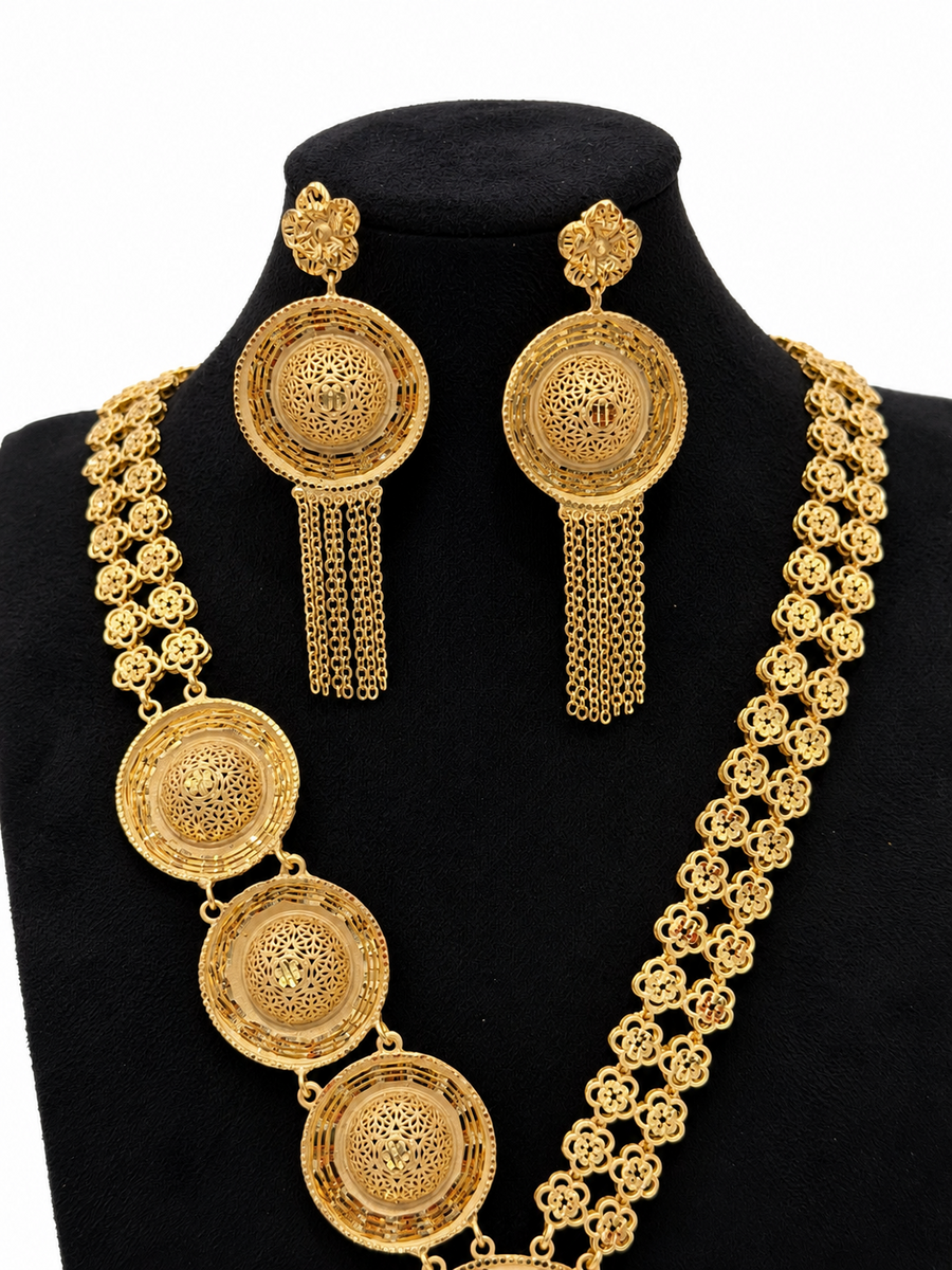 Close-up of 1 gram gold-plated circular filigree necklace and tassel earrings