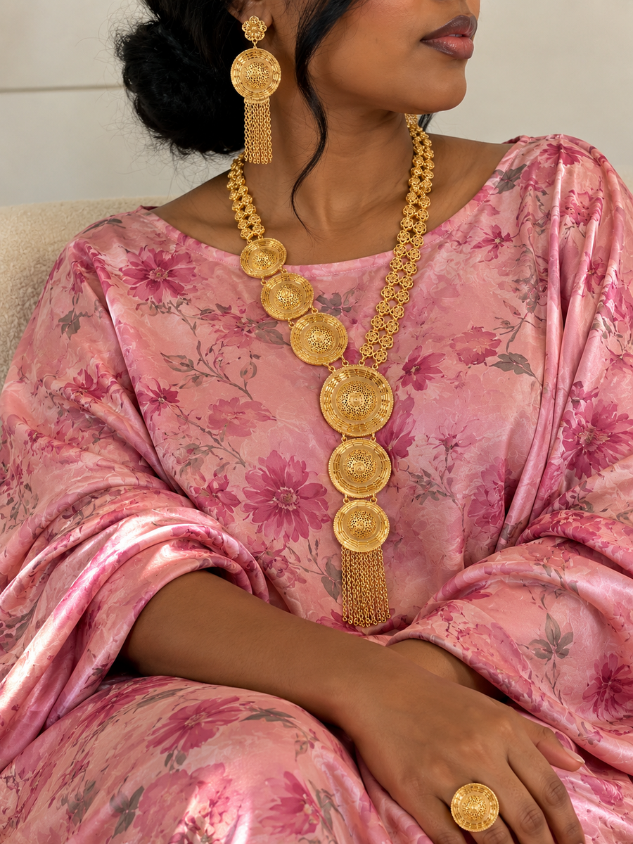 Model wearing 1 gram gold-plated circular filigree jewellery set with necklace, earrings and ring
