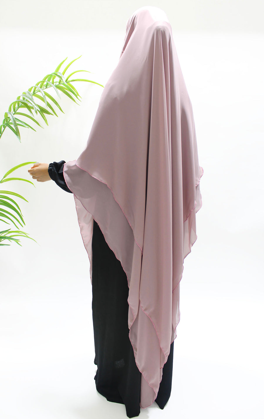 Side view of the rose mauve chiffon khimar showing length and back tie straps