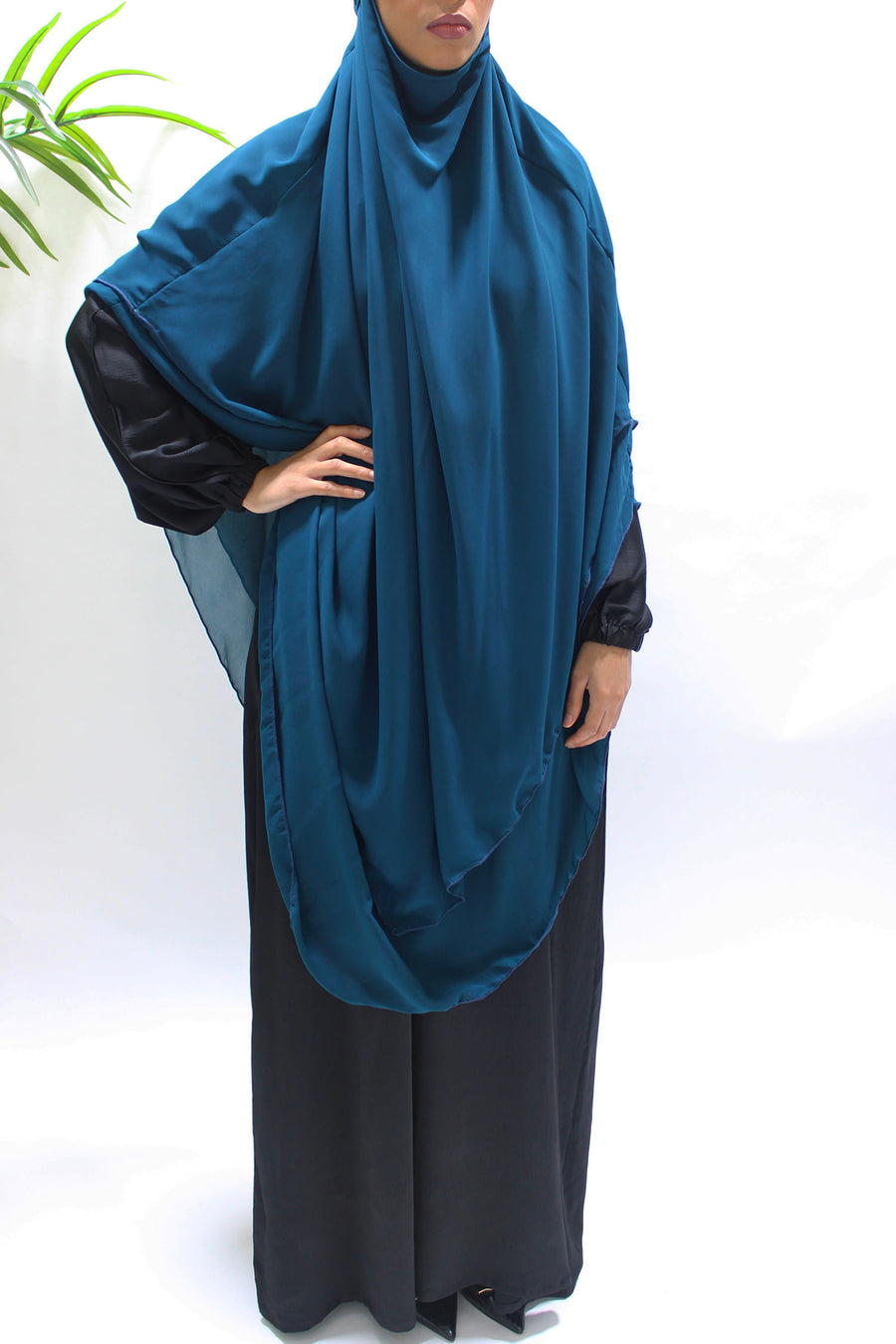 Back view of the teal chiffon khimar showing the tie straps