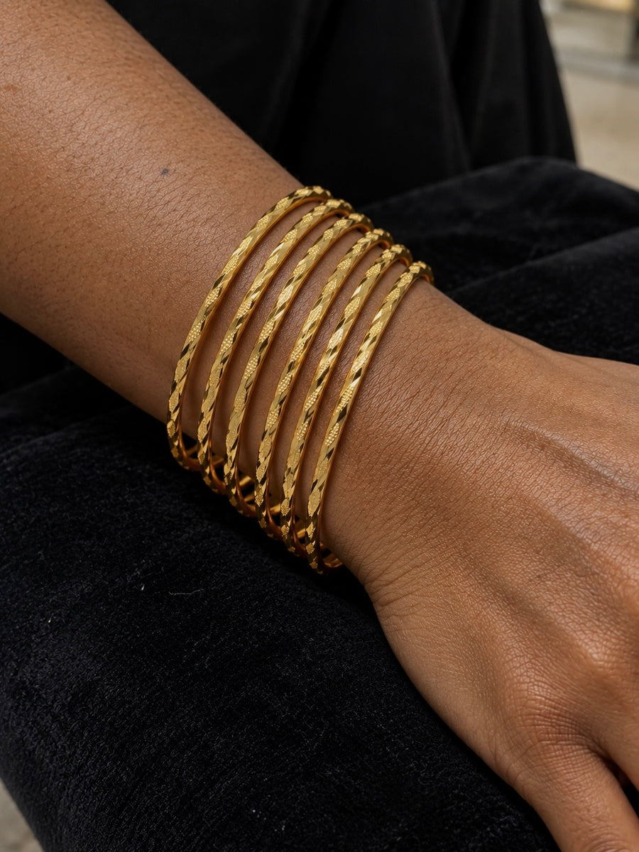 24K gold plated set of 8 bangles worn on the wrist