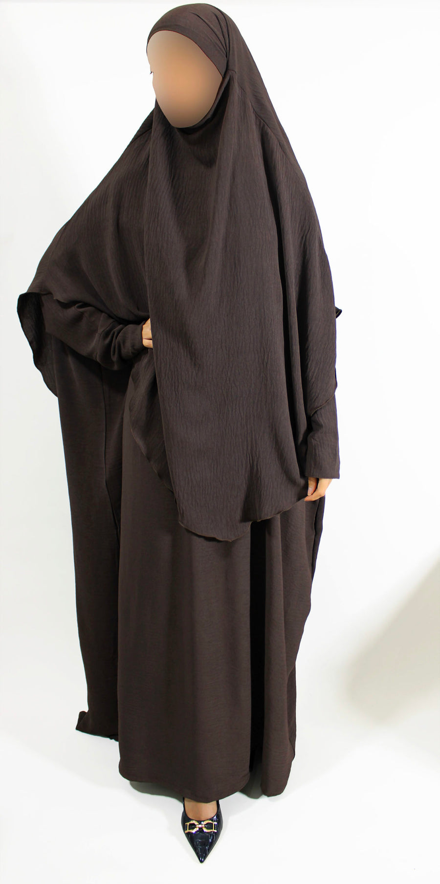 Brown overhead abaya showing the loose fit and crepe drape