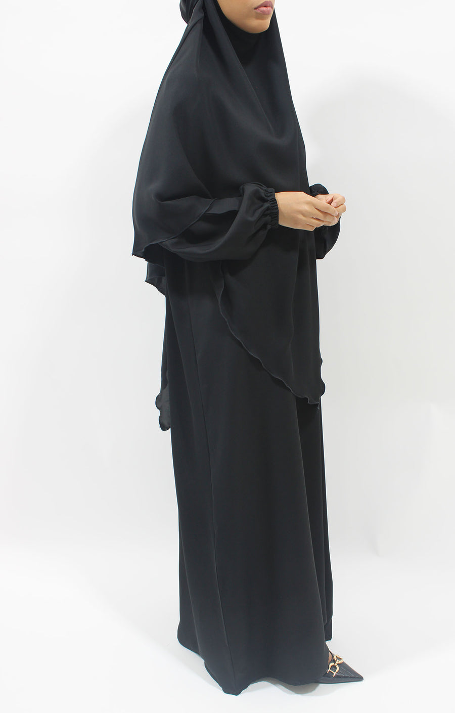 Black overhead abaya showing the loose fit and Neda drape
