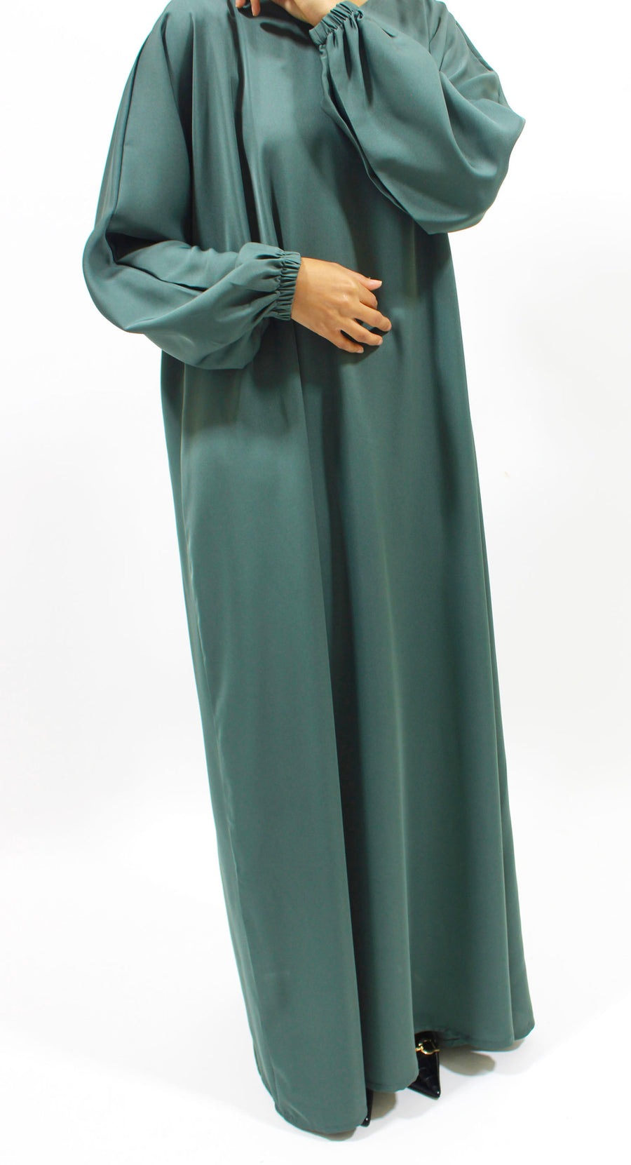 Pine green abaya, khimar and niqab set styled together