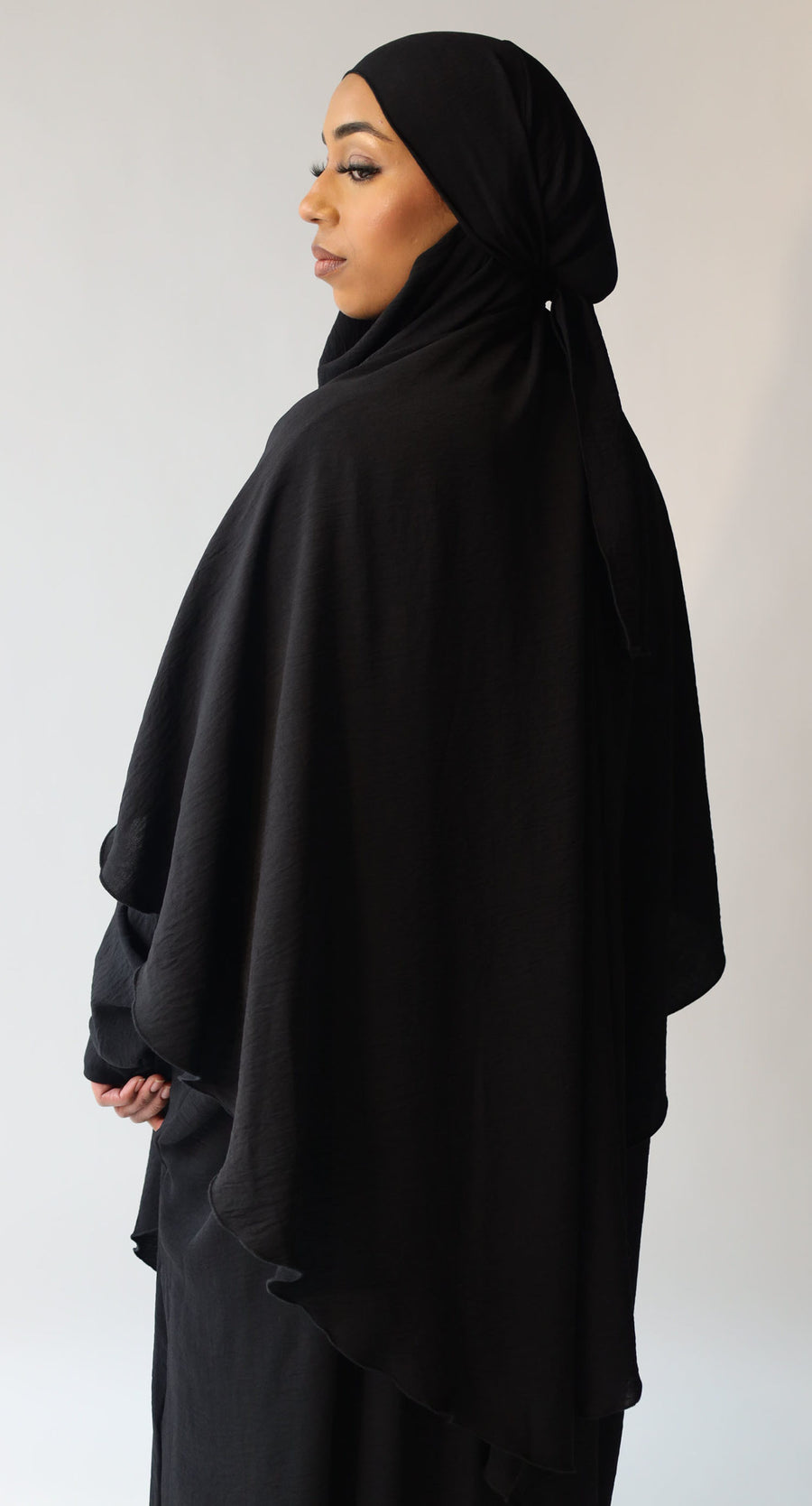 Black diamond-shaped khimar showing full chest coverage