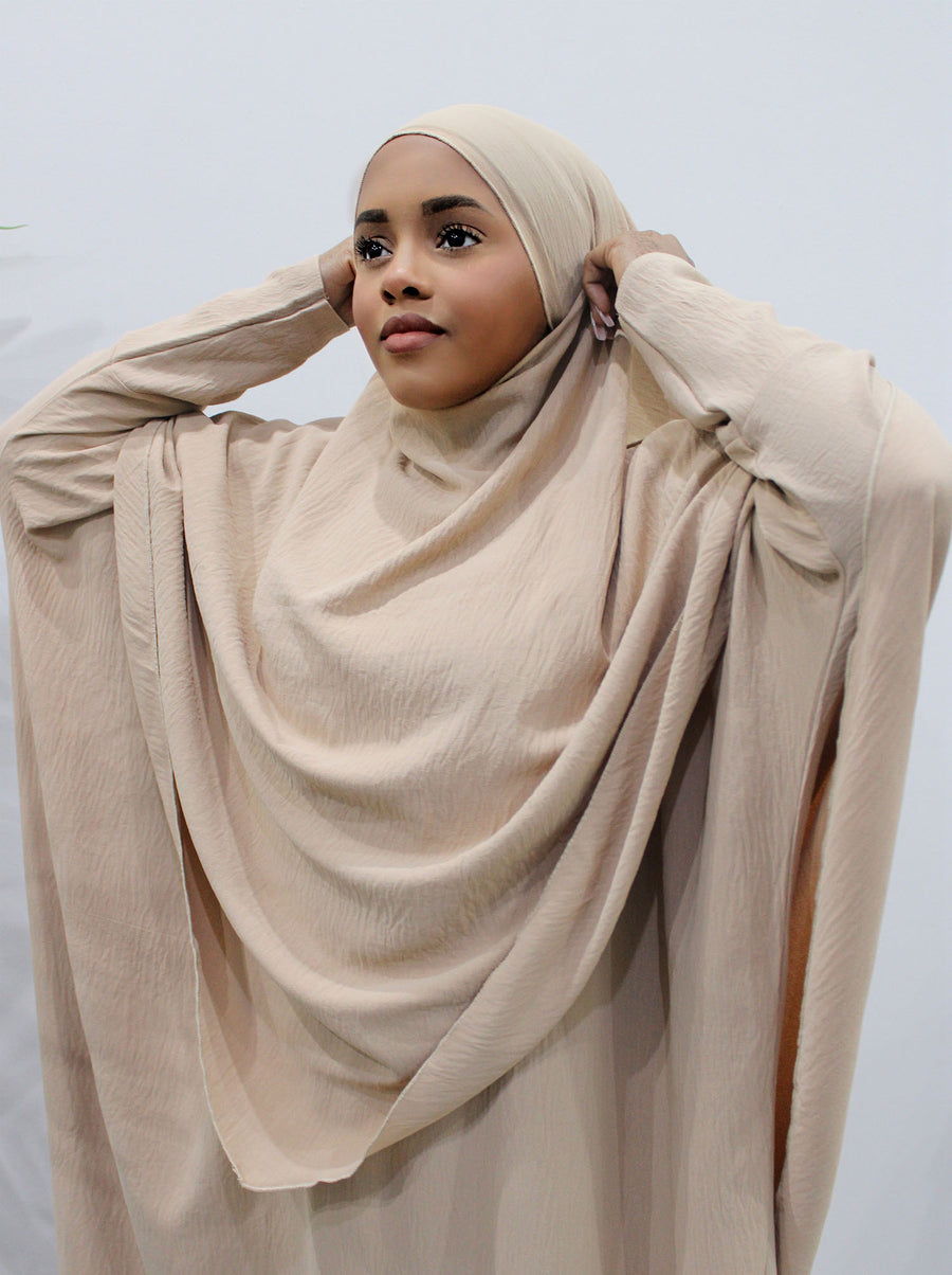 Back of the buff khimar showing the tie straps