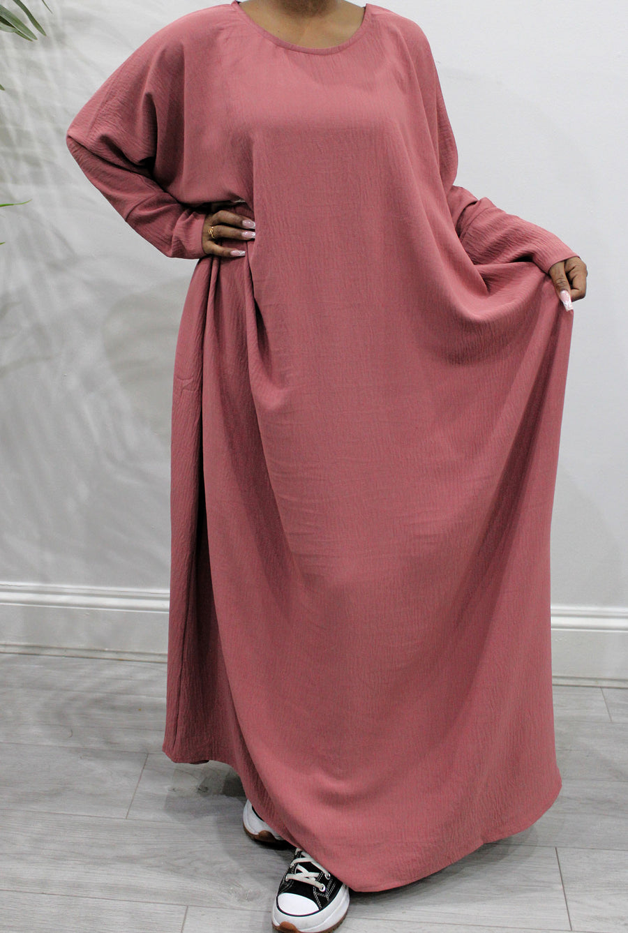 Coral diamond-shaped khimar showing full chest coverage