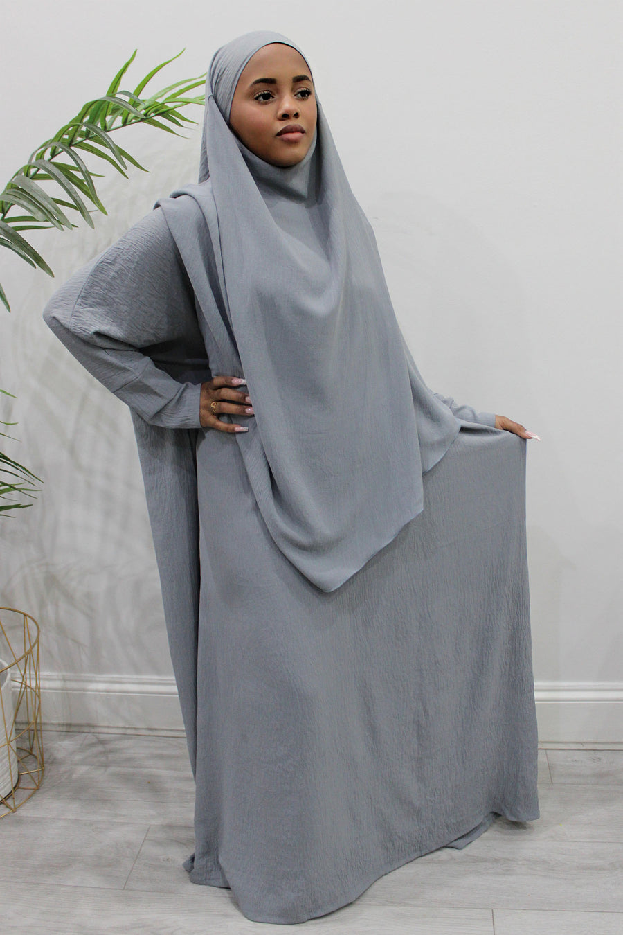 Back of the light grey khimar showing the tie straps