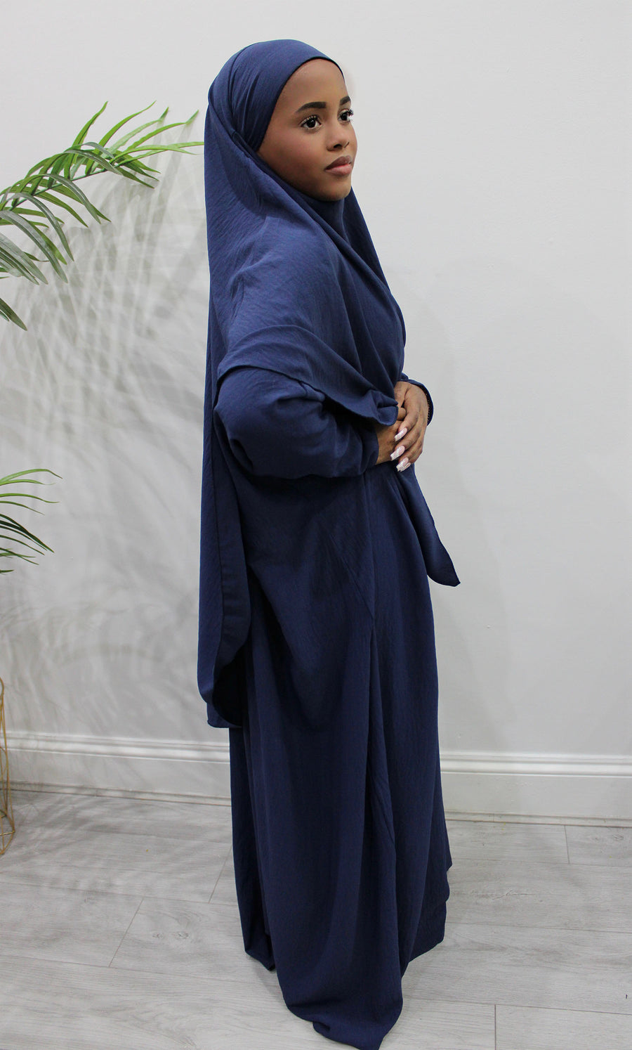 Navy diamond-shaped khimar showing full chest coverage