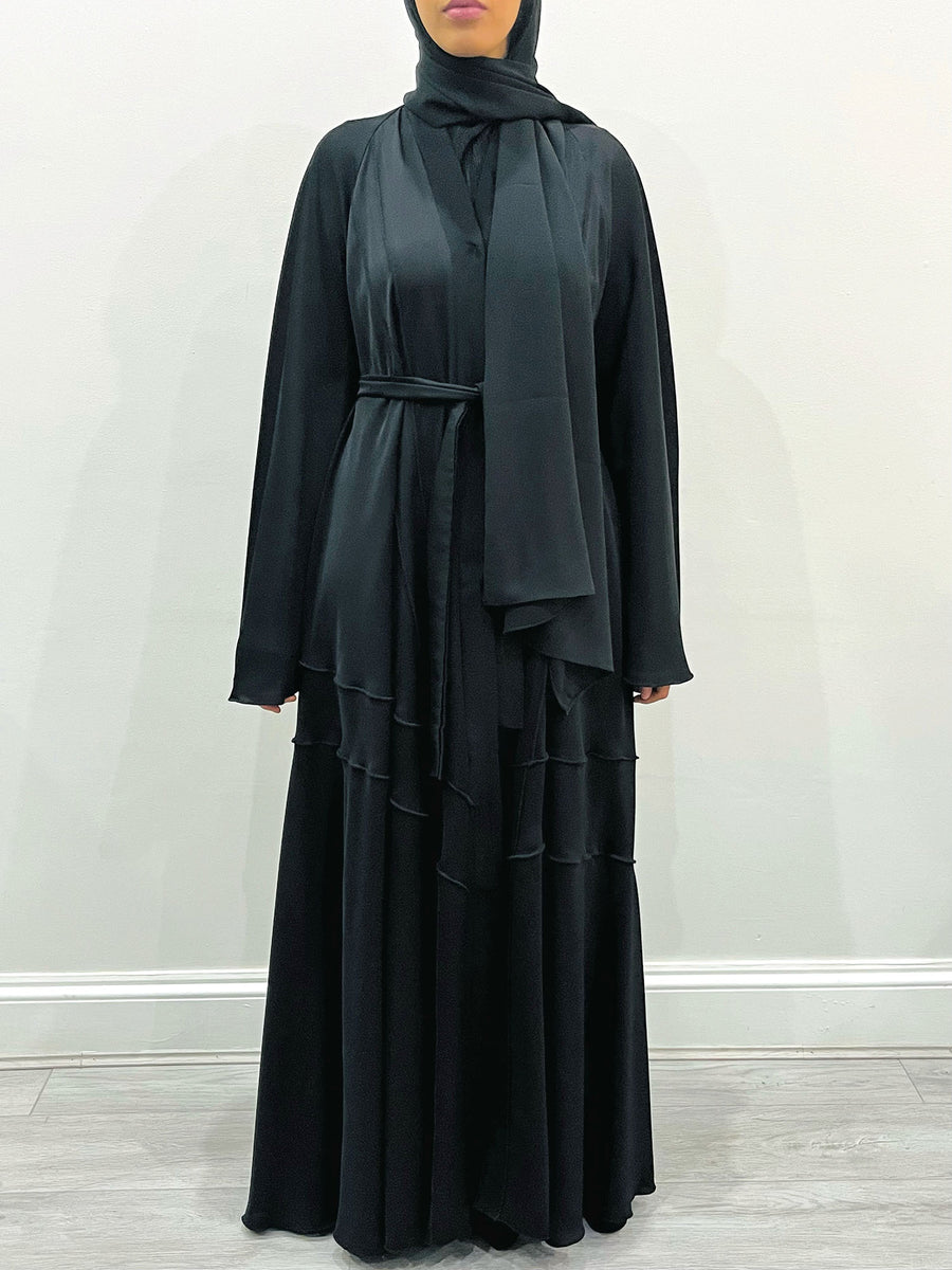 Black umbrella-cut abaya belted at the waist, front view