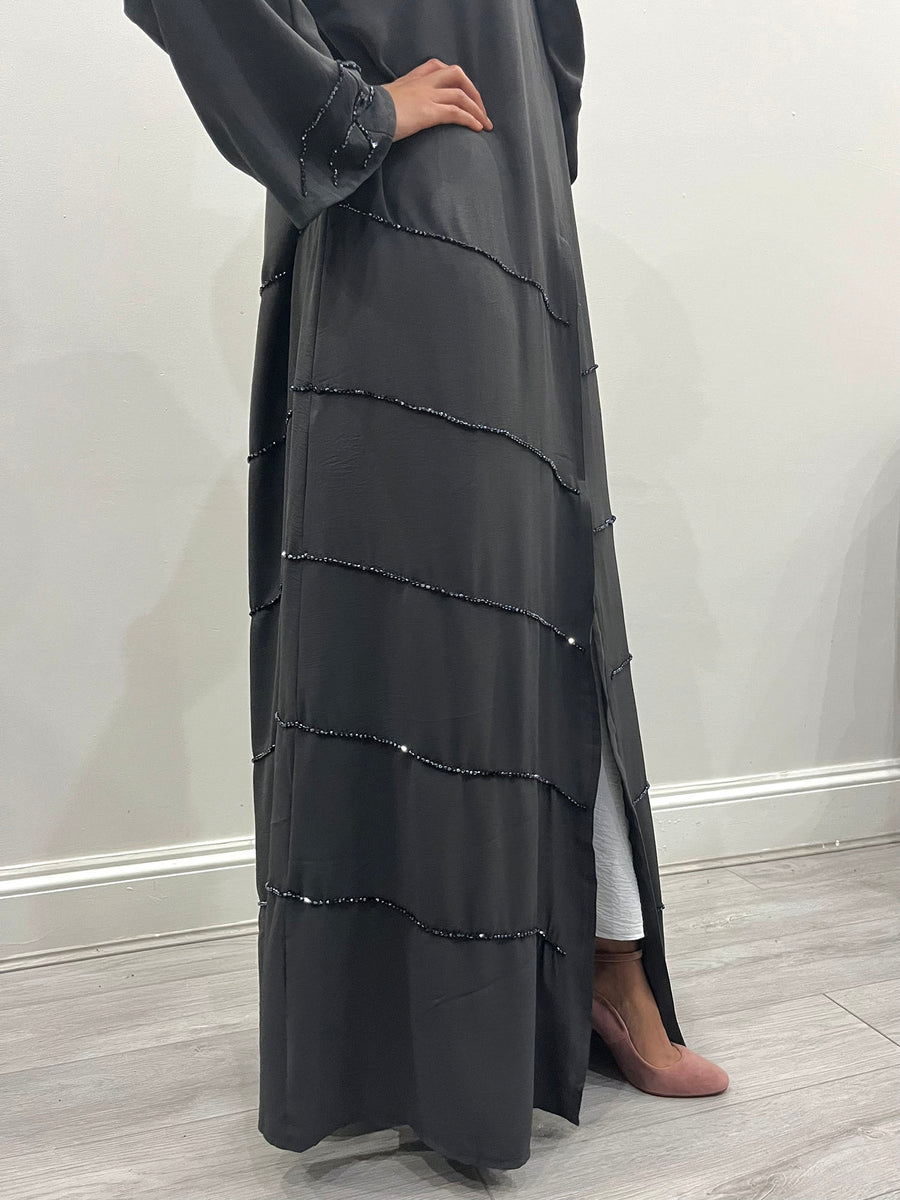 Close-up of the beadwork on the charcoal grey chiffon abaya