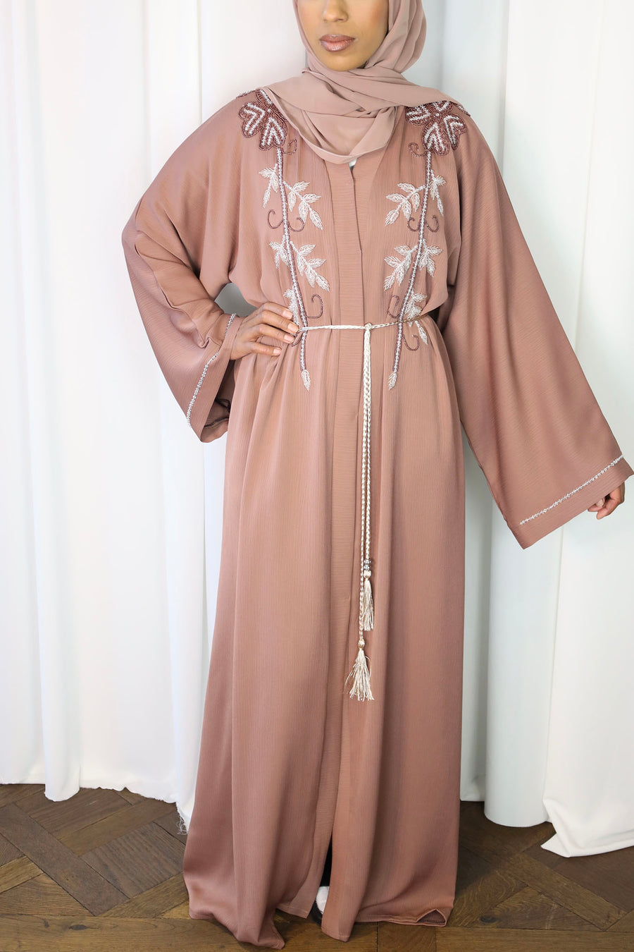 French rose abaya shown with its matching hijab and belt