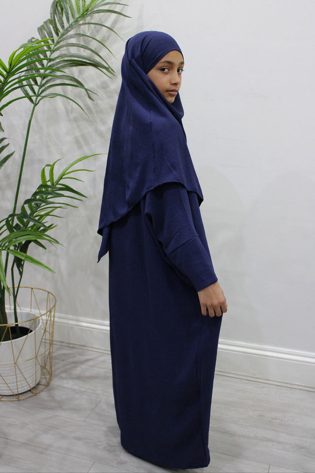 Girl wearing Amani's navy abaya and khimar set, front view