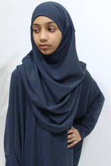 Girl wearing Amani's slate grey abaya and khimar set, front view