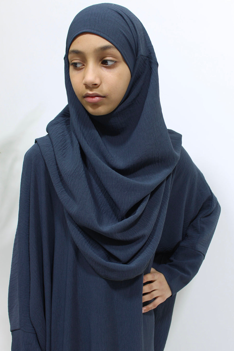 Girl wearing Amani's slate grey abaya and khimar set, front view