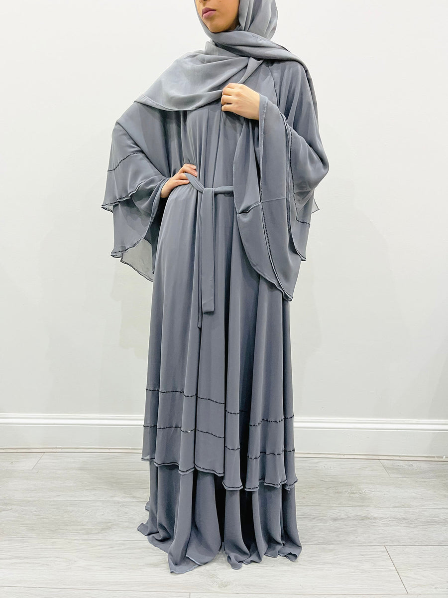 Grey chiffon abaya shown with its matching hijab and belt