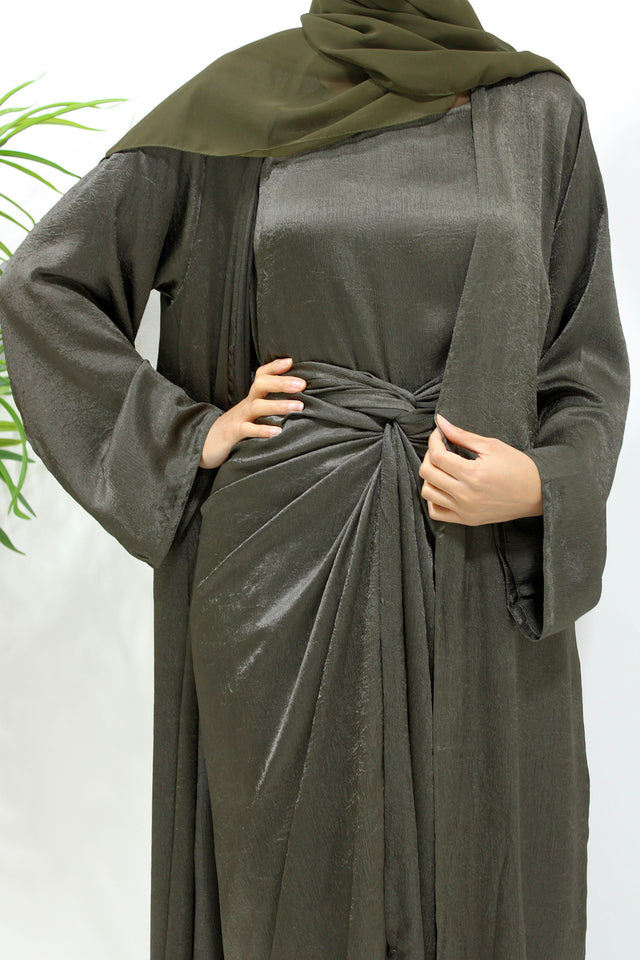 Army green crushed satin four-piece open abaya set shown front-on with kimono abaya, inner dress and wrap skirt
