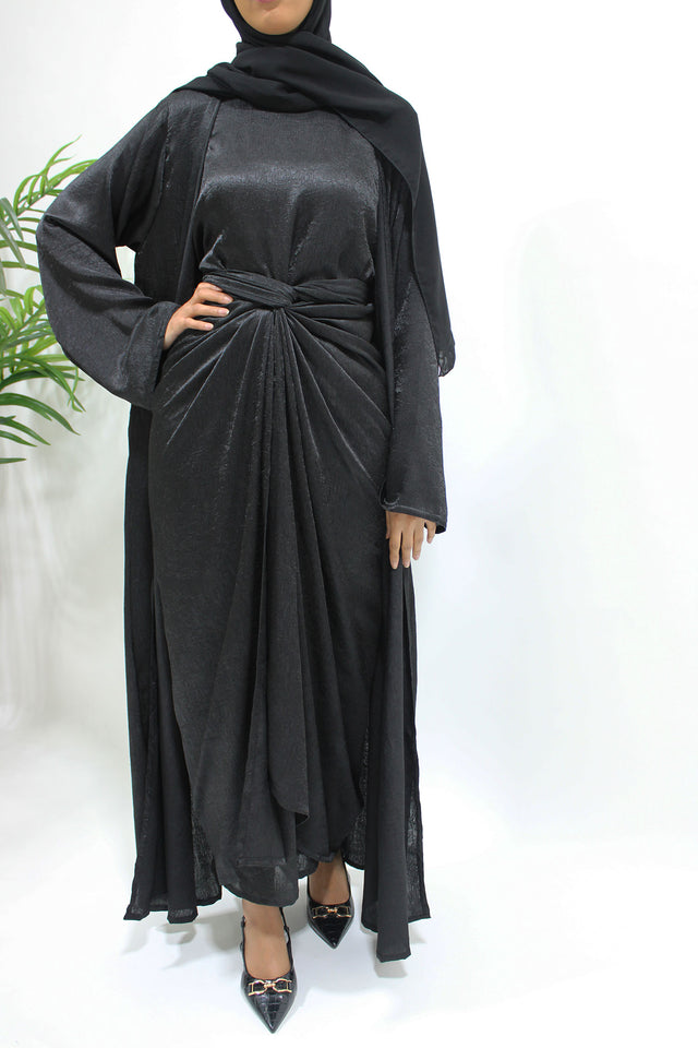 Black crushed satin four-piece open abaya set shown front-on with kimono abaya, inner dress and wrap skirt