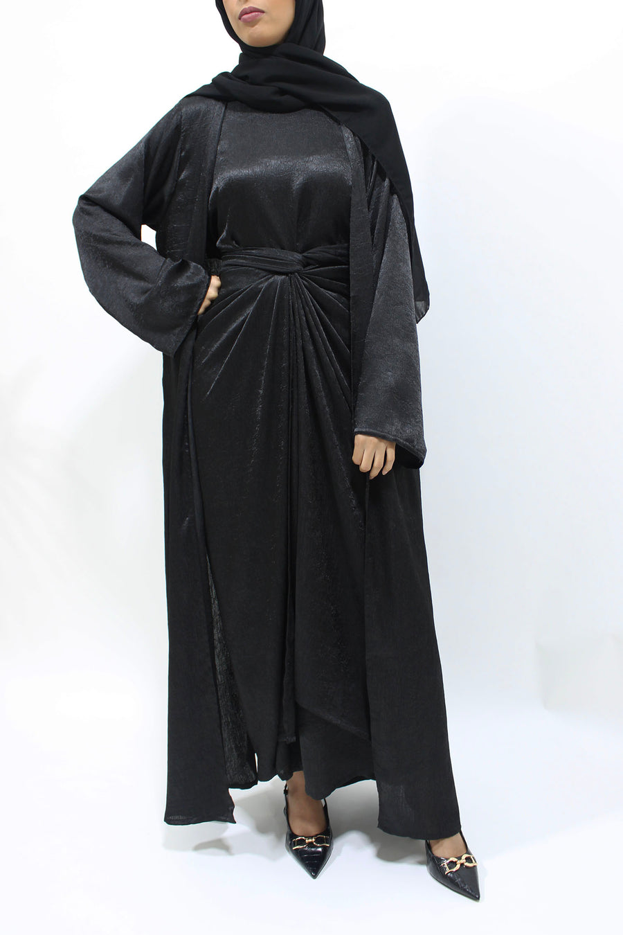 Full-length view of the black crushed satin four-piece set with flowing open kimono abaya