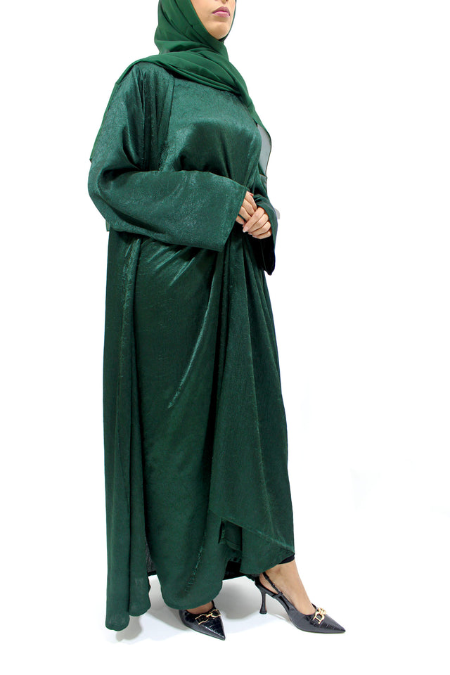 Forest green crushed satin four-piece open abaya set shown front-on with kimono abaya, inner dress and wrap skirt