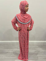 Little girl wearing Amani's pink rose one-piece slip-on prayer dress with attached hijab