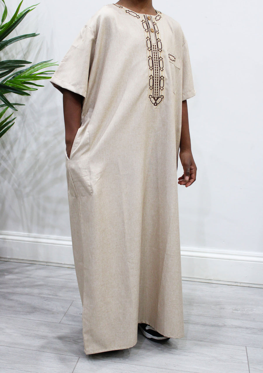 Older boys short-sleeved beige Moroccan thobe side view
