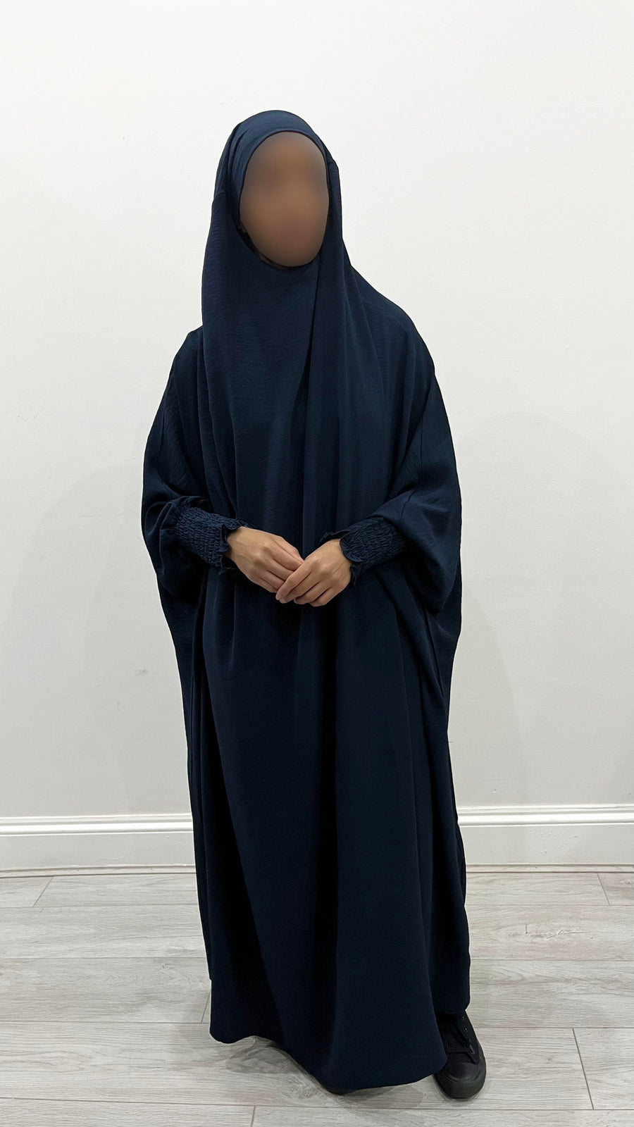 Navy blue full jilbab showing its soft crepe drape and full-length coverage