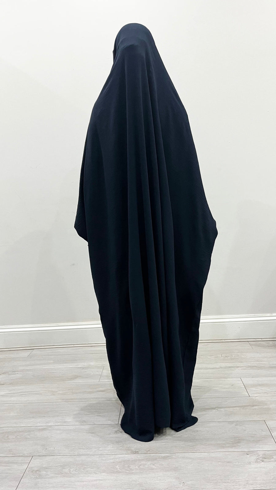 Navy blue overhead jilbab with tie straps for secure coverage