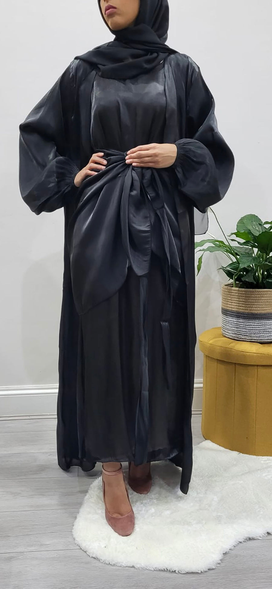 Full-length view of the black organza silk open abaya over the matching slip dress