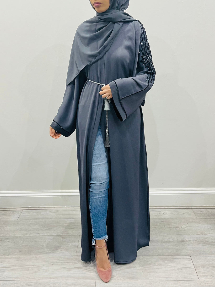 Back view of the slate gray abaya showing the beadwork across the back