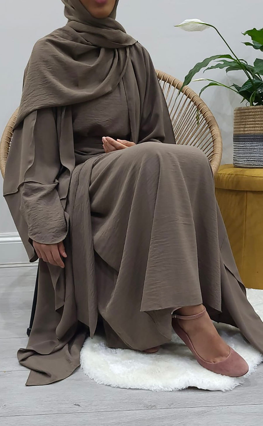 Dark taupe open abaya styled over its matching inner slip dress