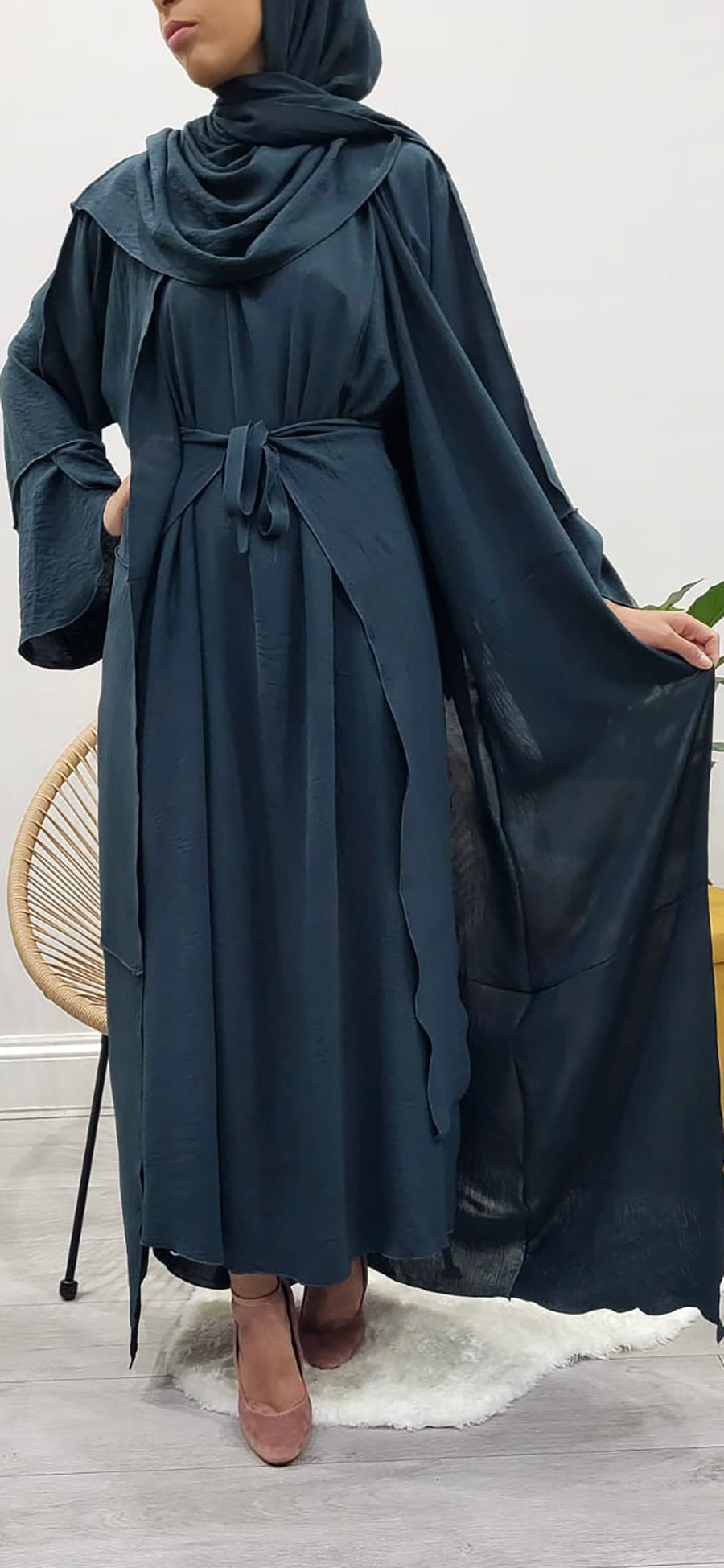 Teal open abaya styled over its matching inner slip dress