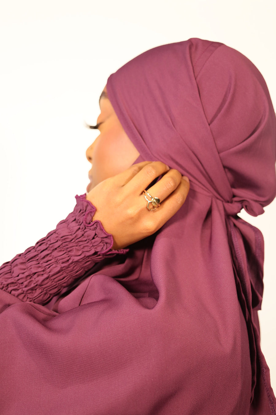 Plum jilbab set showing the overhead top with longer back and ruched cuffs