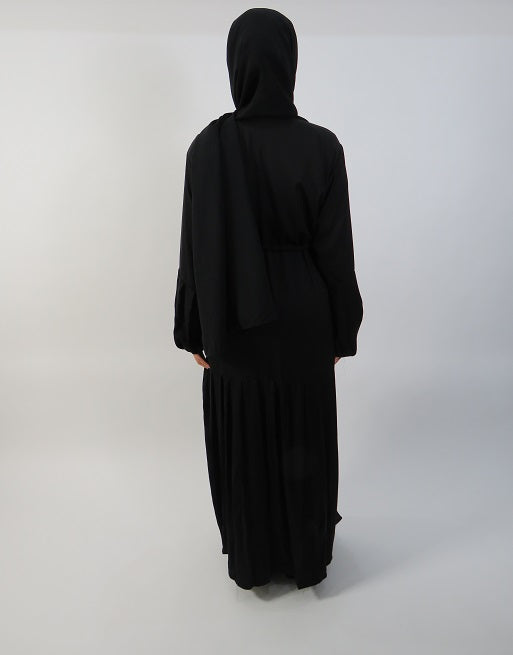 Black open abaya showing pleated lower half