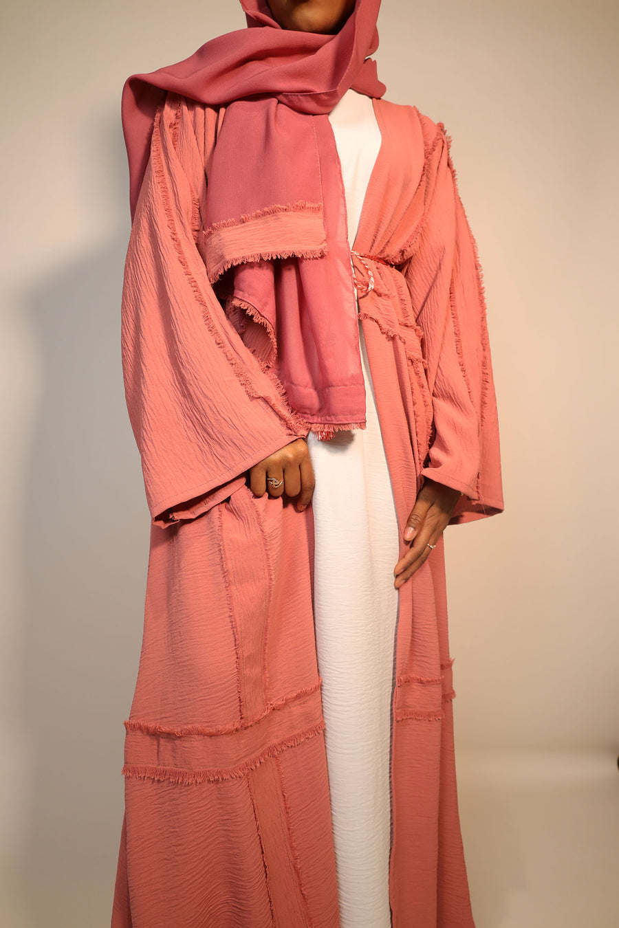 Dark salmon abaya showing the soft cotton-blend drape