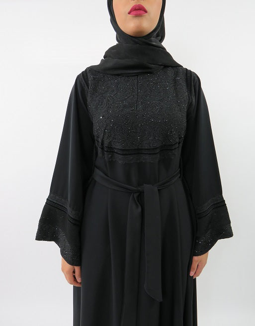 Close-up of black embellished lace on Neda abaya