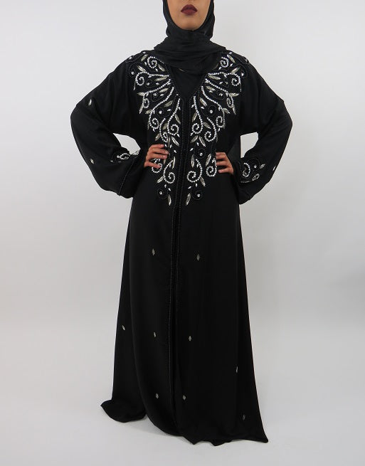 Close-up of the intricate handmade embellishment on the designer abaya