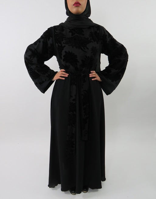 Black-on-black floral velvet abaya with external belt, side angle