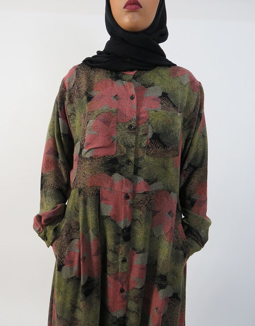 Full-length view of Amani's green floral open maxi dress