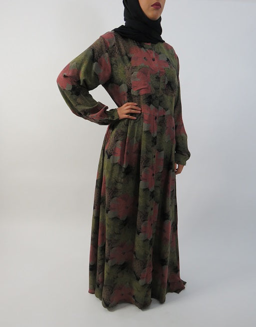 Side pocket and floral print detail on the green cotton maxi dress