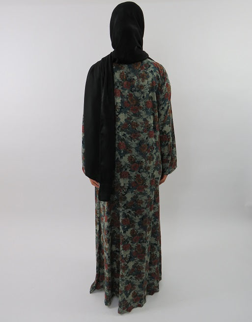 Side view of Amani's green floral cotton maxi dress