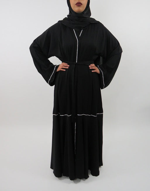 Black abaya showing waist belt and wide sleeves