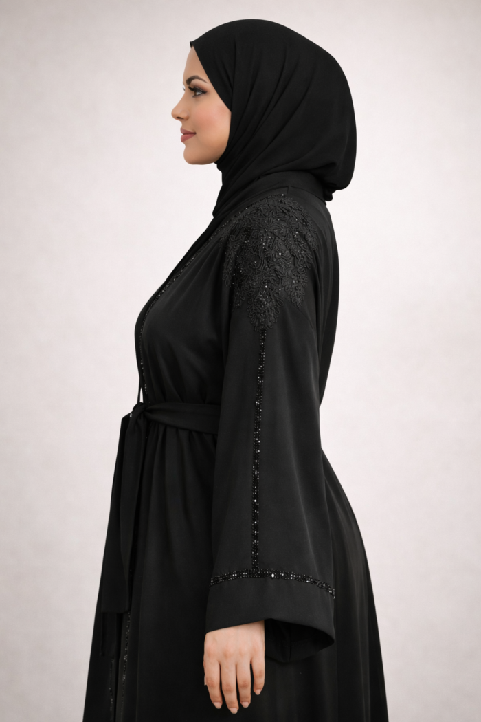 Black abaya jacket layered over an outfit