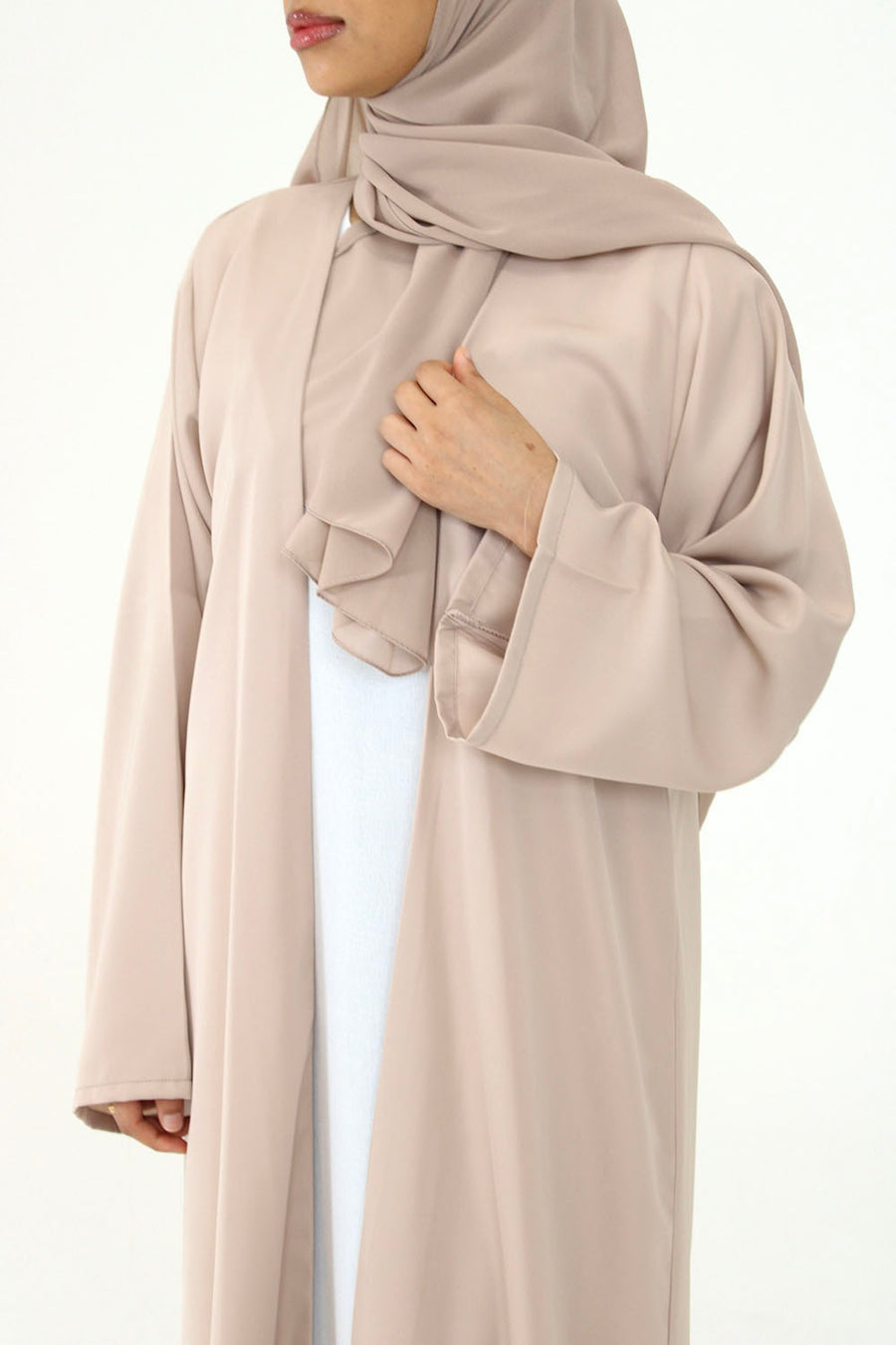 Beige duster abaya detail showing the soft neutral tone