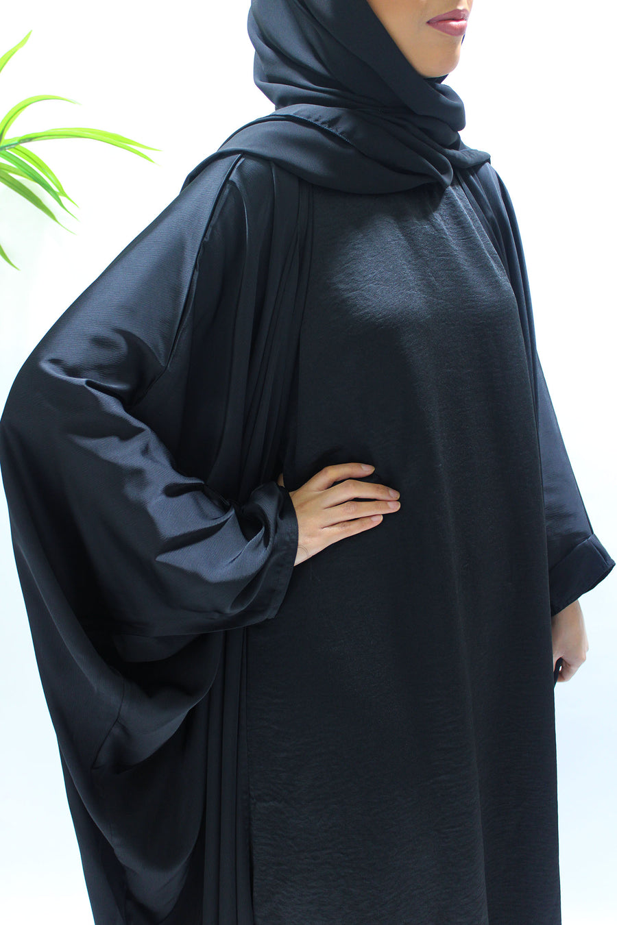 Textured satin detail on the black farasha abaya