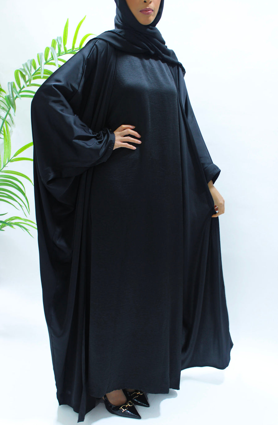 Black sleeveless inner dress included with the farasha set