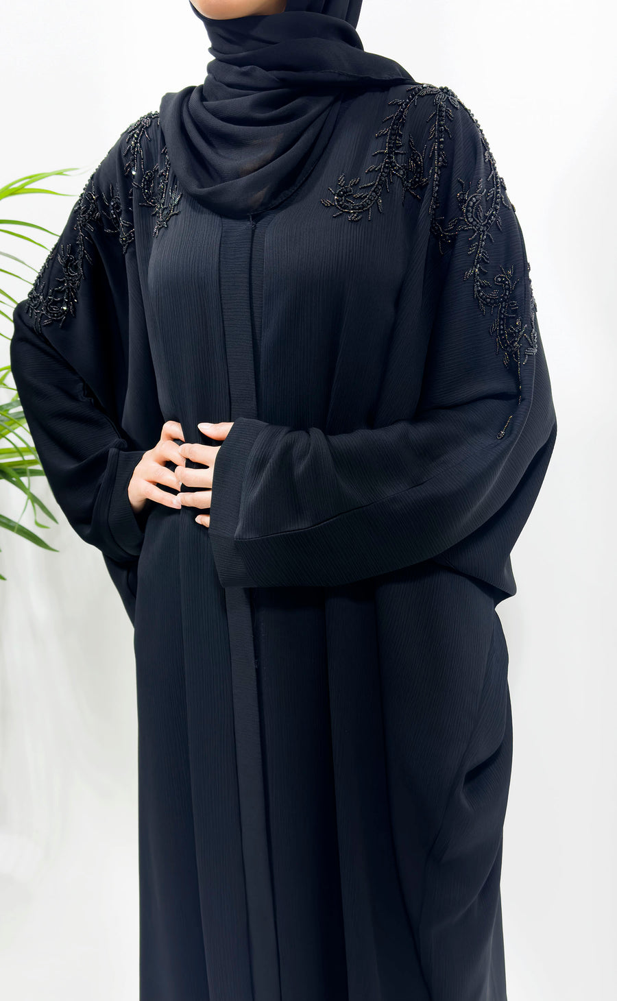Black-on-black embellished open batwing abaya shown front-on with matching hijab