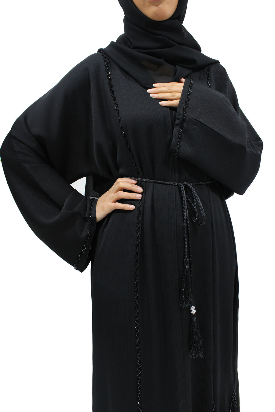 Close view of the hand-stitched black diamante piping on the black abaya