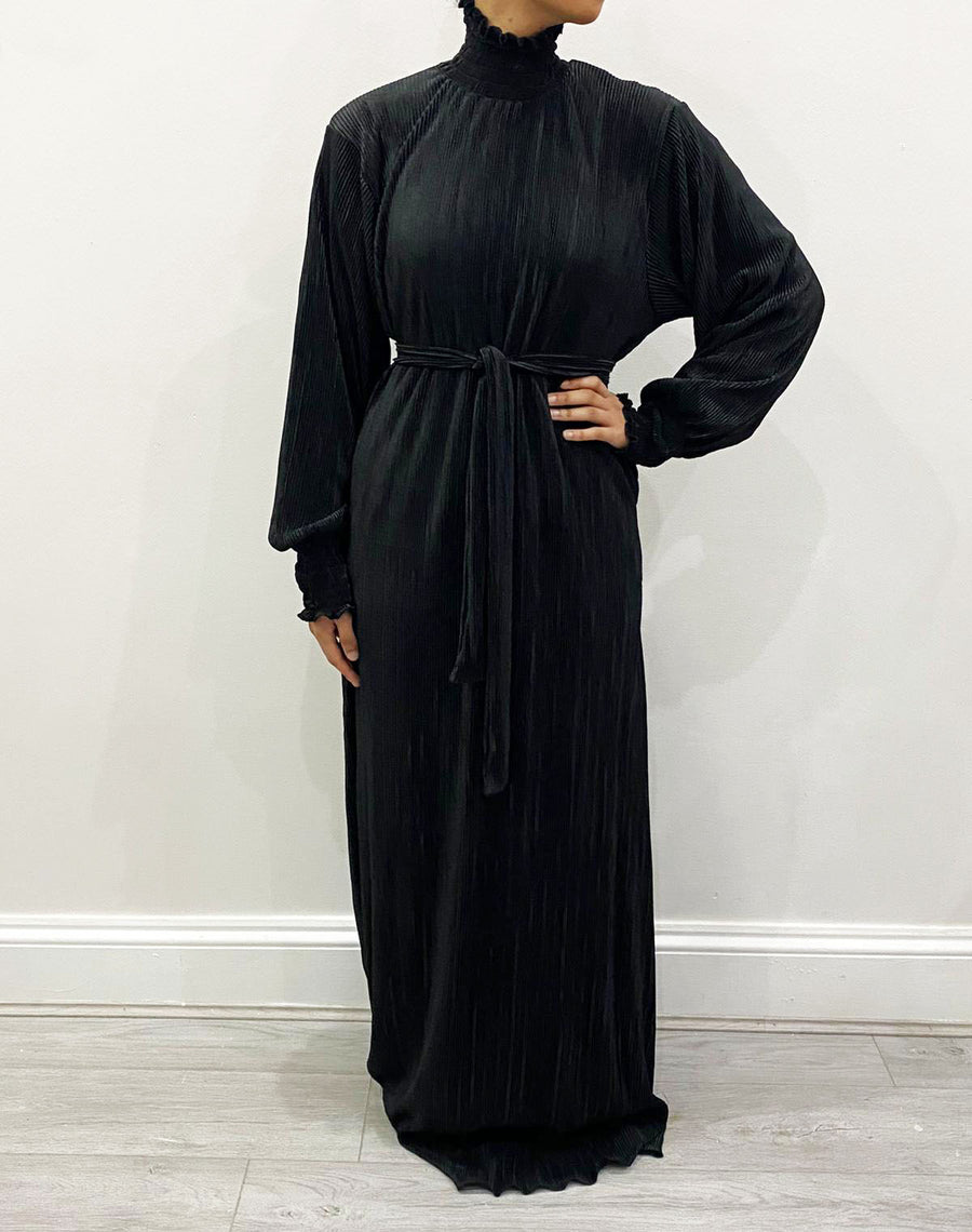 Black satin turtleneck maxi dress shown from the side